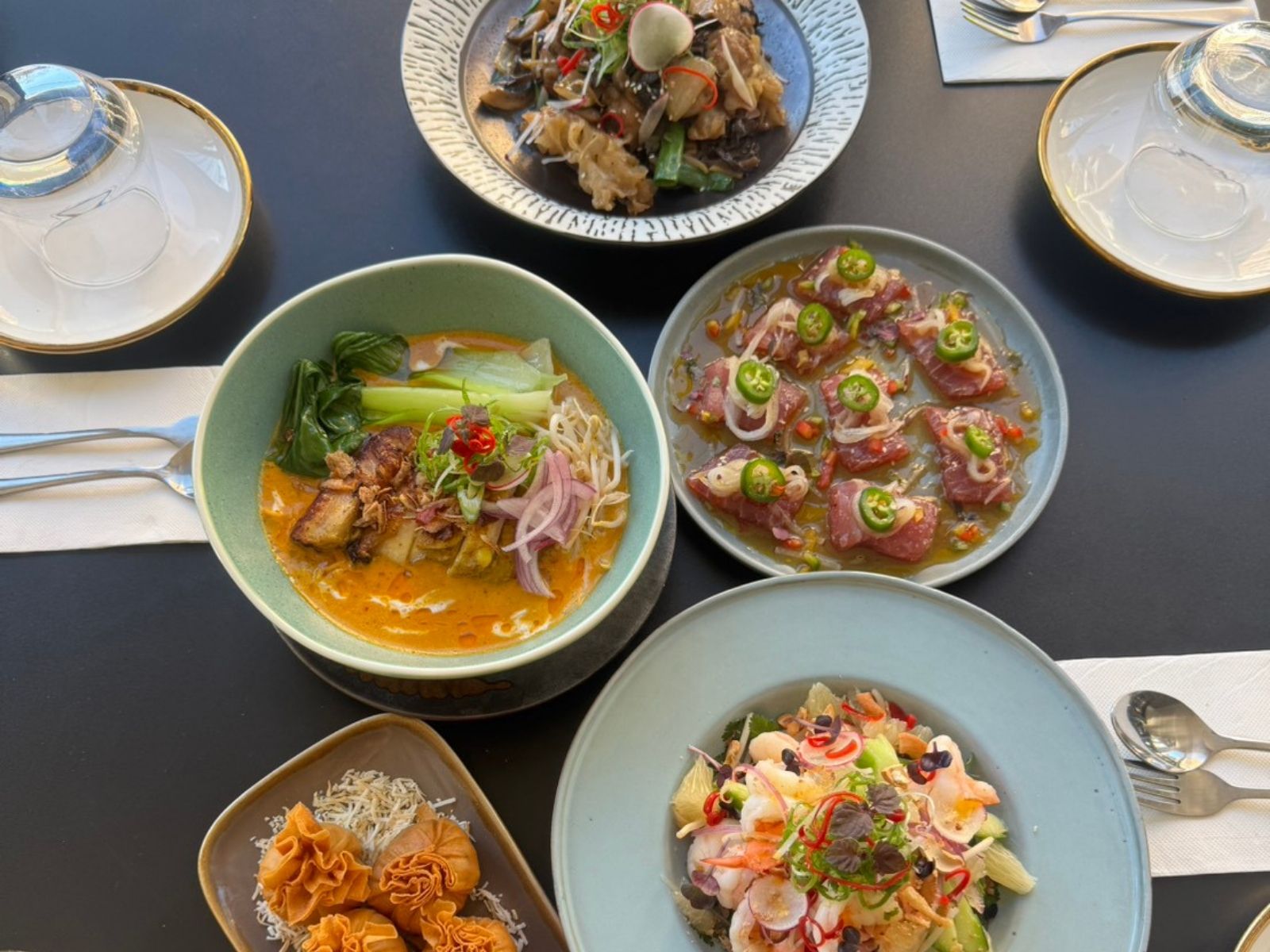 Shared plates of modern Asian dishes at Once Again Terrigal